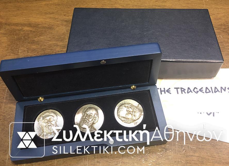 Wooden case with 3 Greek silver coins