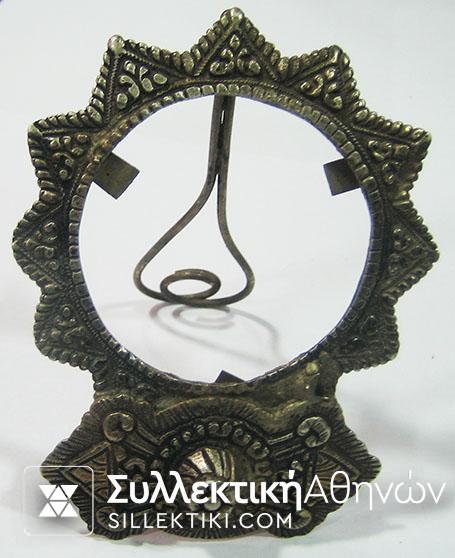 Silver-copper photo frame made out of buckle