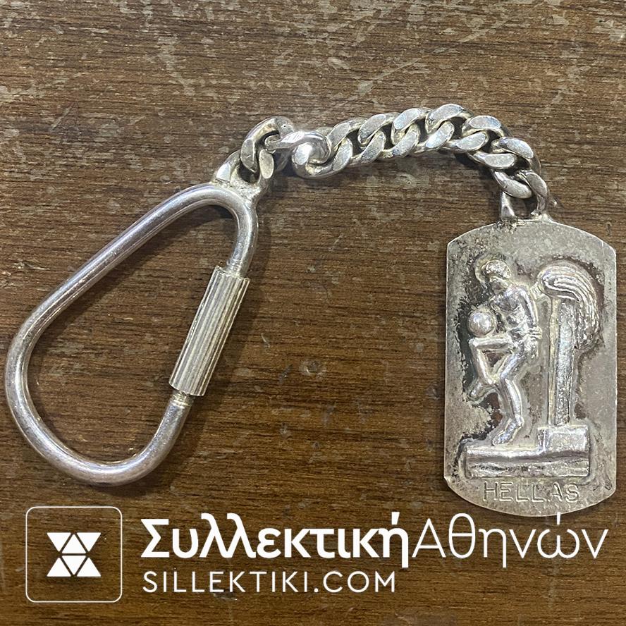 Ασημένιο (925) Μπρελόκ HELLAS MUNDIAL 1994 με αρχαία παράσταση εφήβου που παίσει ποδόσφαιρο (απόδειξη ότι και το ποδόσφαιρο είναι Ελληνκή επινόηση !)