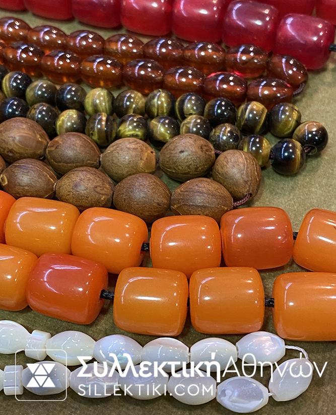 A collection of 15 rosaries made of various artificial and natural materials