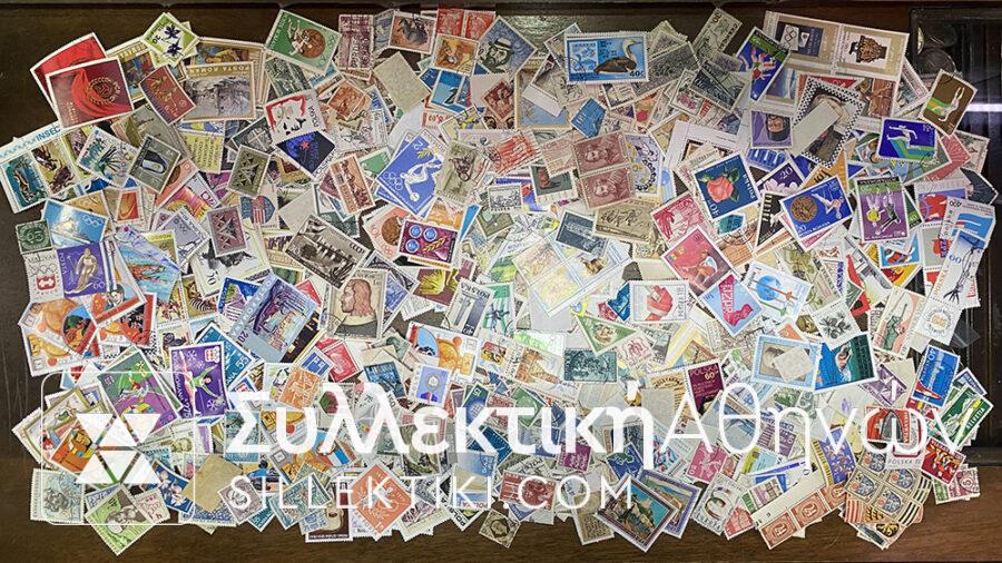 Many hundreds, maybe even thousands, of stamps from all over the world. They are taken from binders from collections.